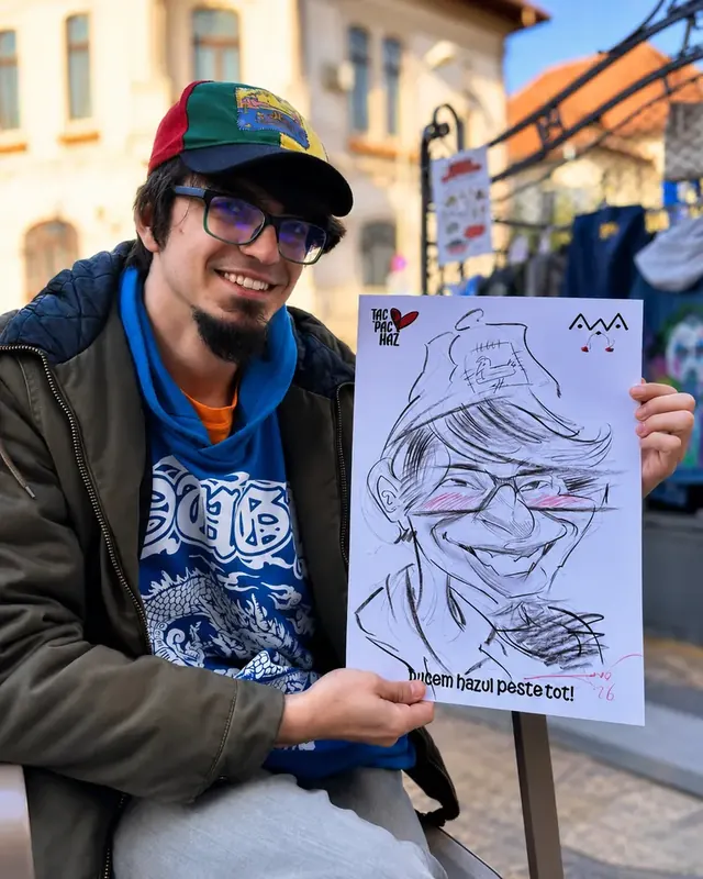 Un tânăr cu șapcă, pe stradă, cu caricatura lui